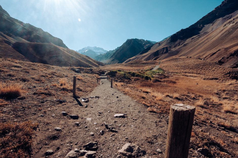 Beautiful hiking trail in the Andes, Mendoza Province, Argentina with clear skies and stunning mountain views.